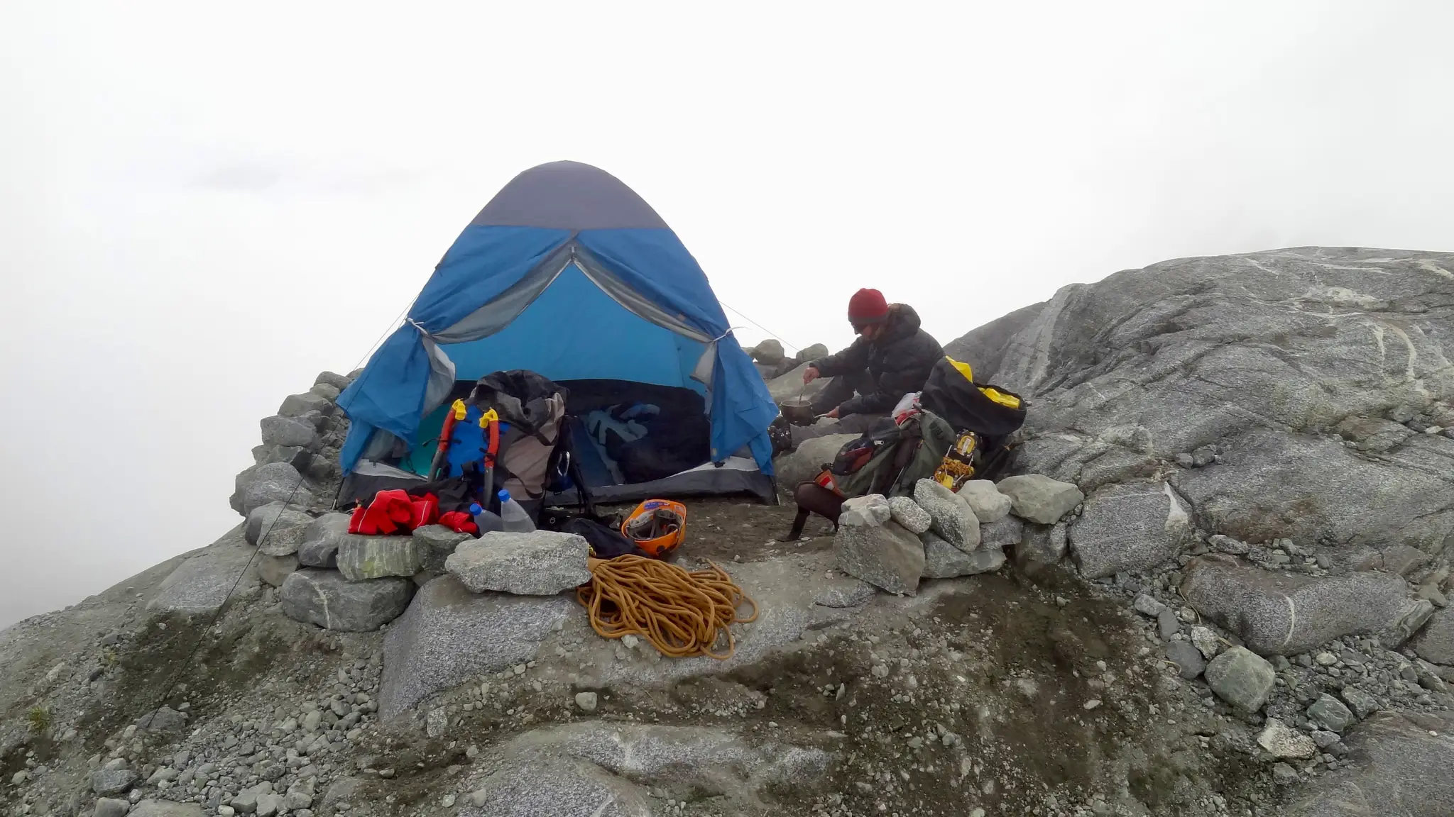 Cooking dinner at the bivouac before the Mount Tutoko summit attempt.