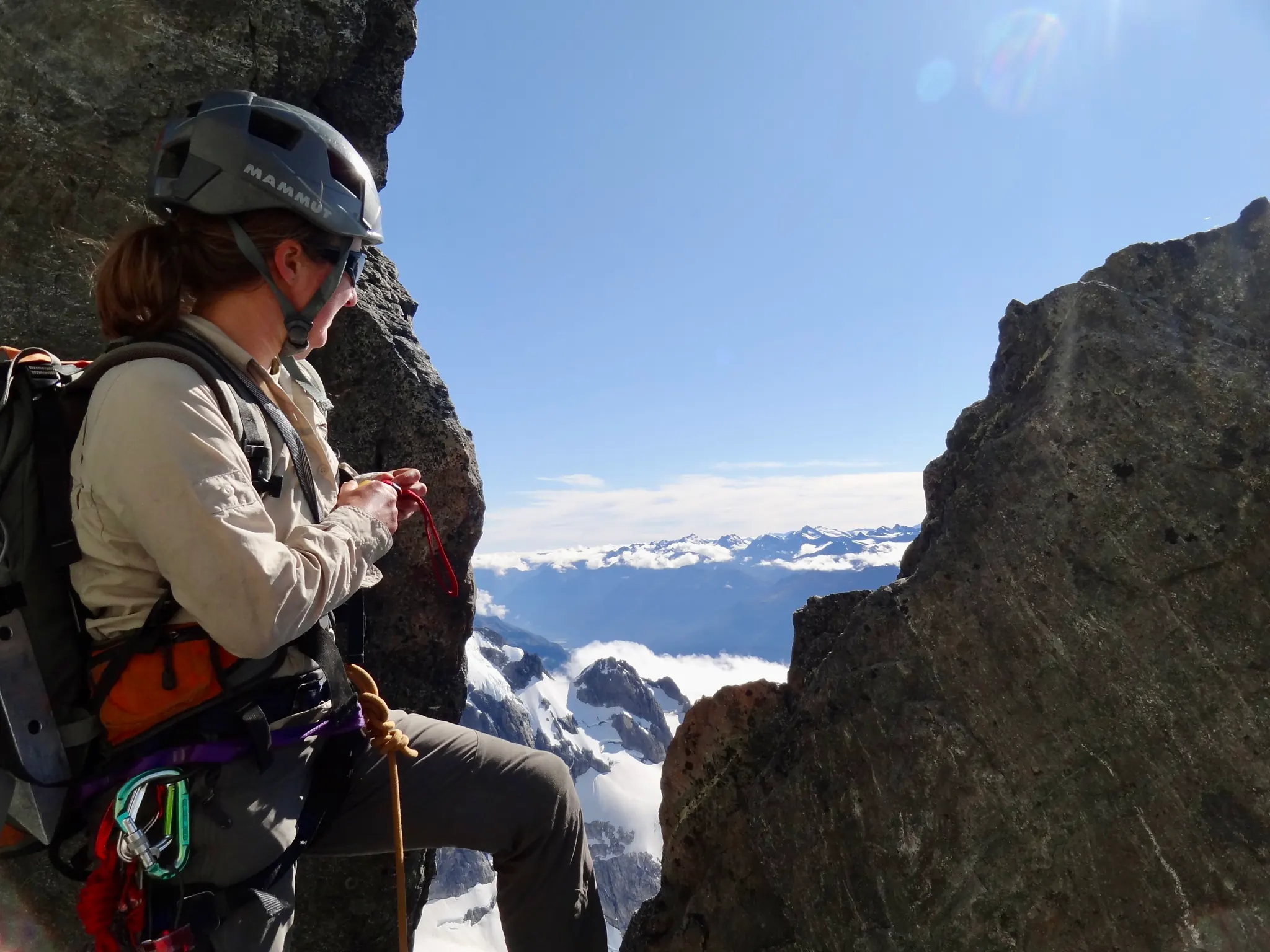 Moving together on the rope through the rocky section on Mount Tutoko.