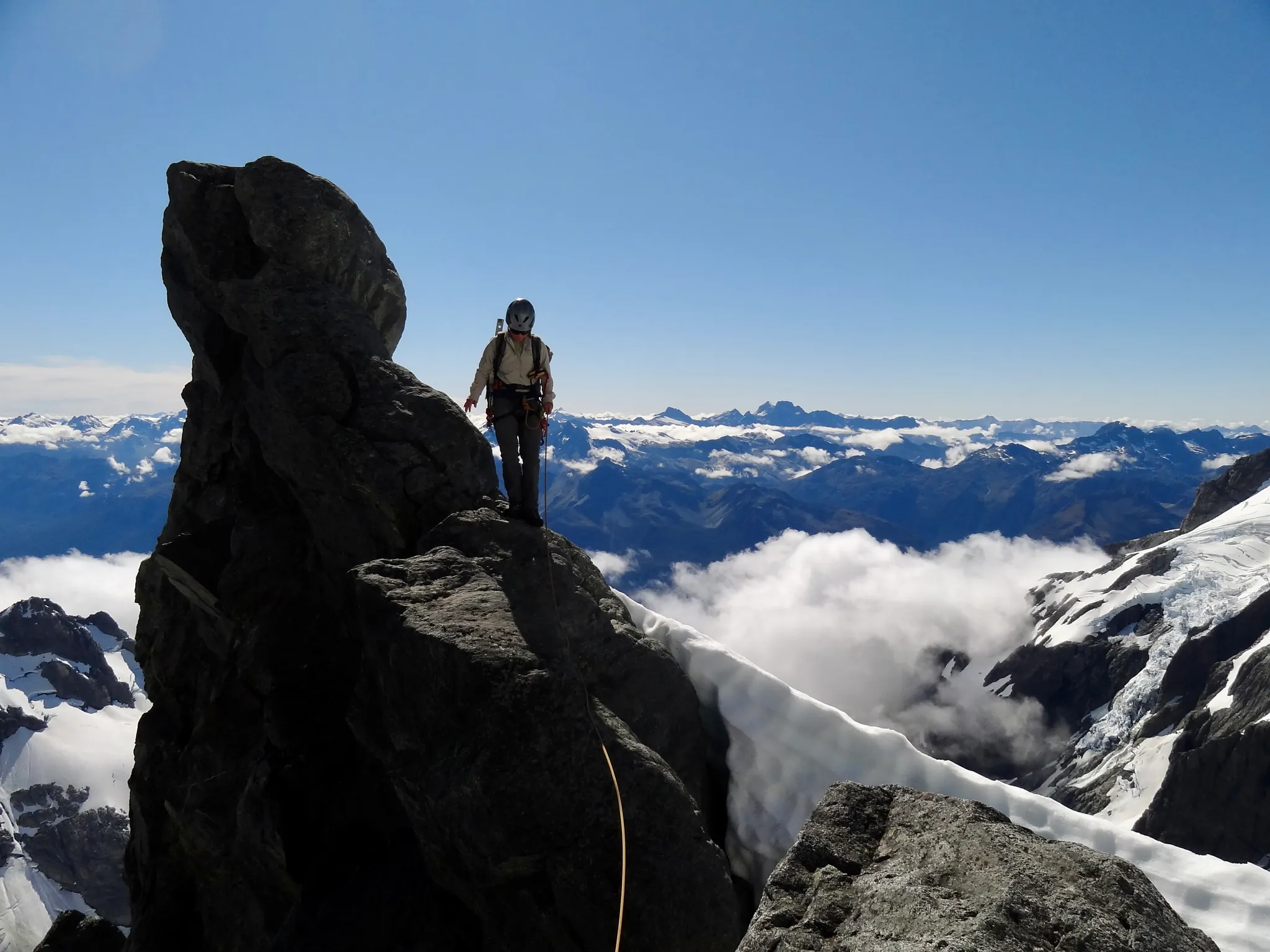 Moving together on the rope through the rocky section on Mount Tutoko.