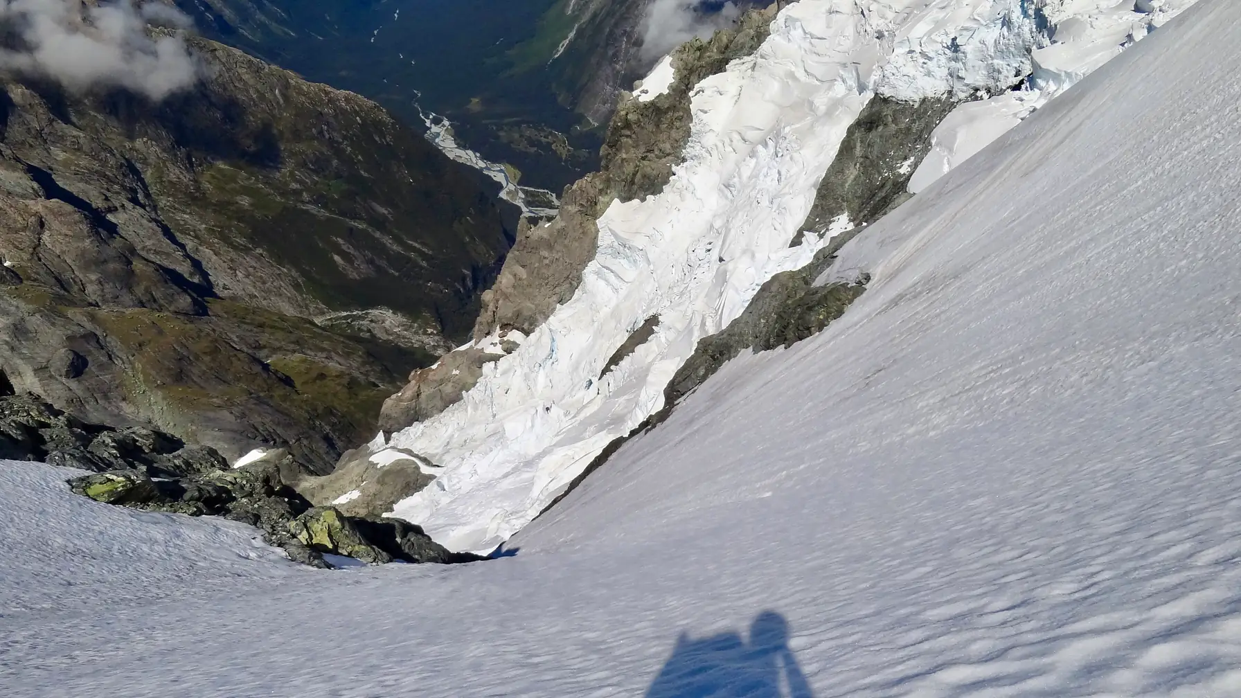 Looking down from the snow ridge of Mount Tutoko.