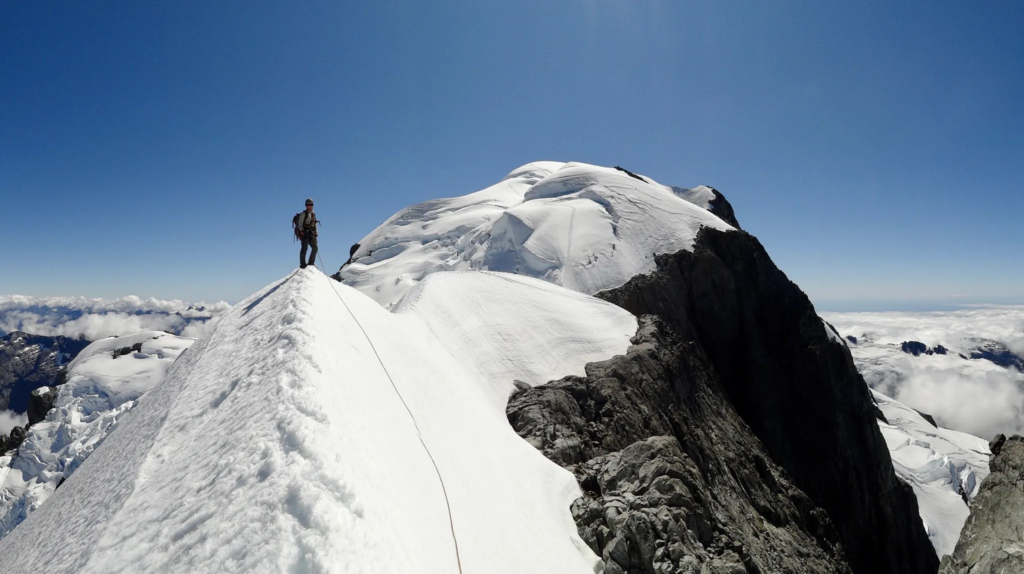 Descending from the summit of Mount Tutoko, back on the snow ridge.
