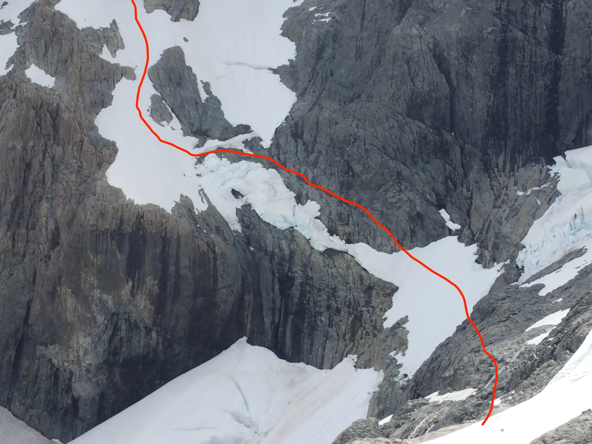 Lower section of our route from the final bivouac across Mount Tutoko's South-East Face, marked in red.