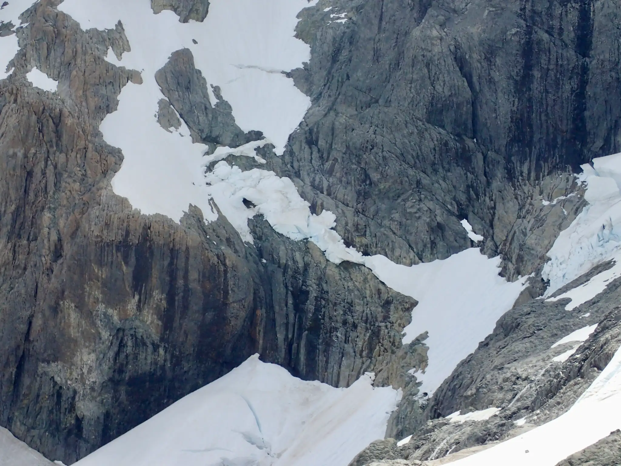 Close-up used to assess a difficult section of our ascent route on Mount Tutoko.